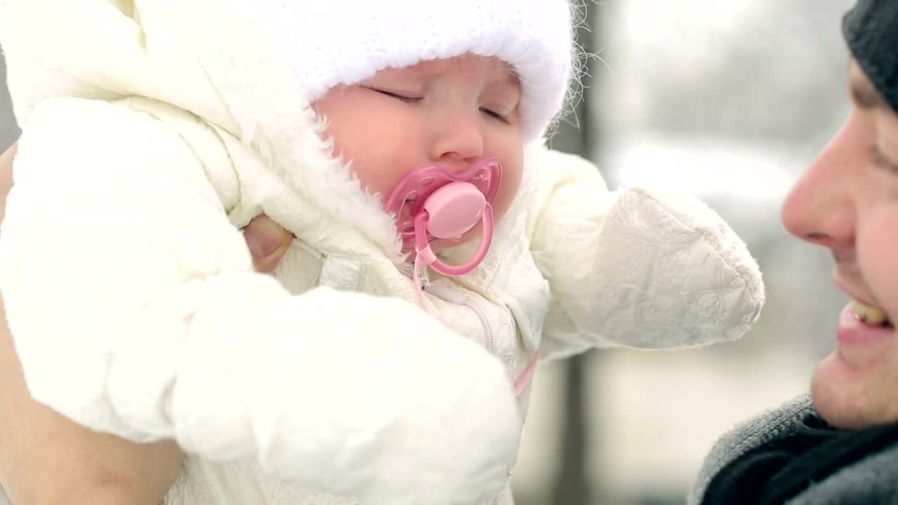 Download Stock Video Father Looking And Kissing His Baby In Winter Live Wallpaper For PC