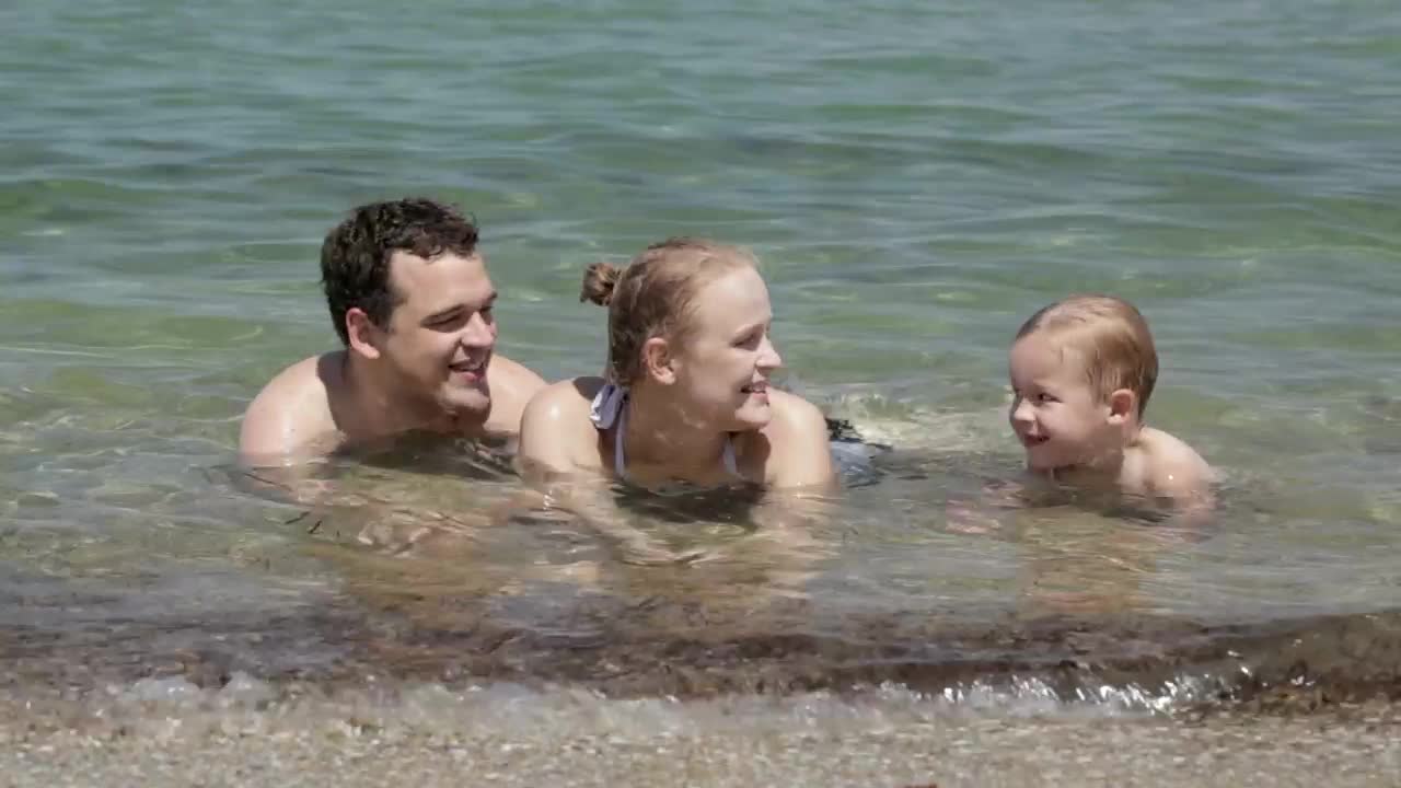 Download Stock Video Family Laying In The Ocean Live Wallpaper For PC