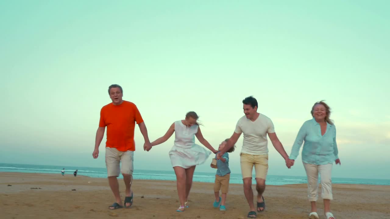 Download Stock Video Family Holding Hands At The Beach Live Wallpaper For PC