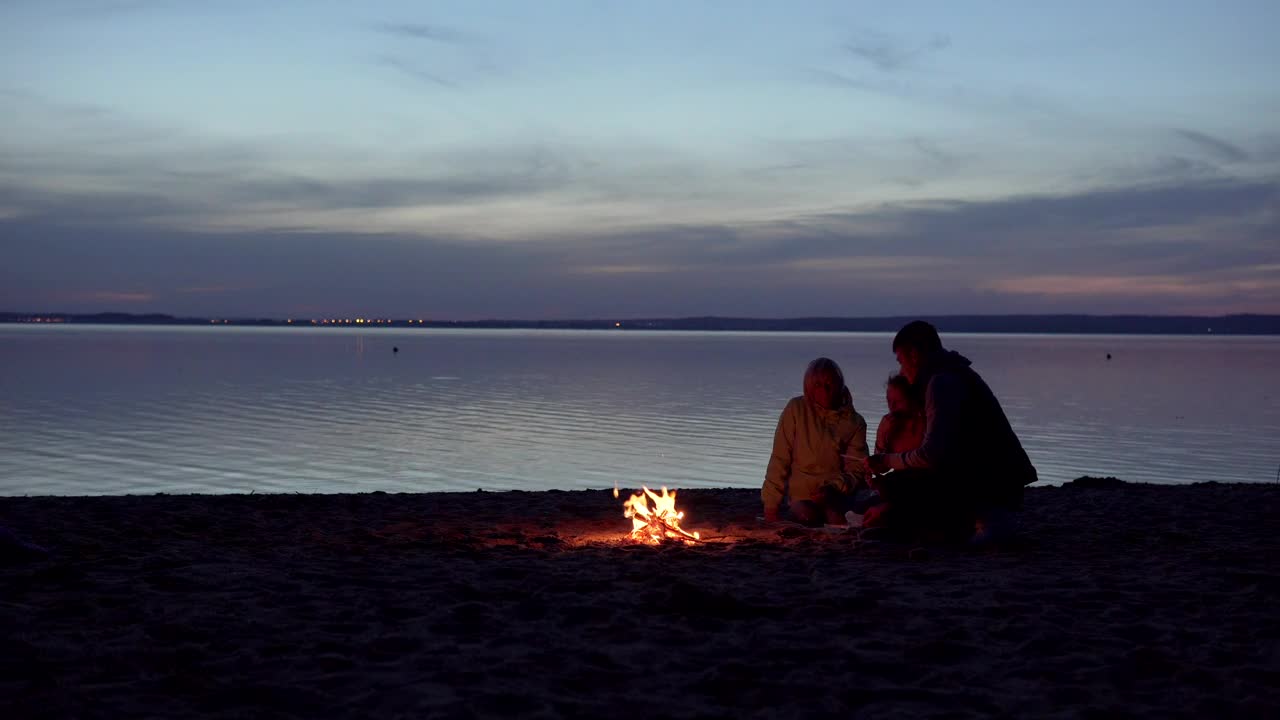 Download Stock Video Family Enjoying A Campfire At The Beach Live Wallpaper For PC