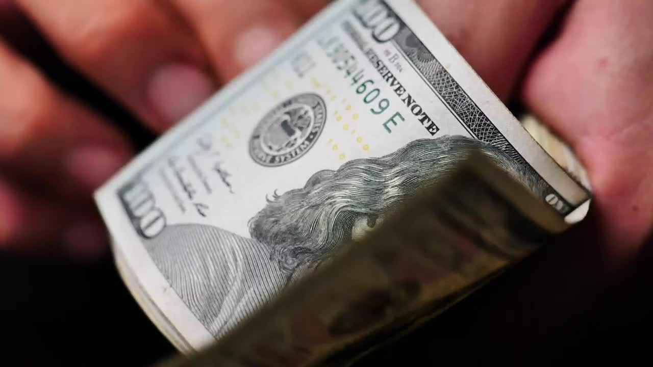 Download Stock Video Hands Flipping Through A Wad Of Dollars Seen Very Close Live Wallpaper For PC