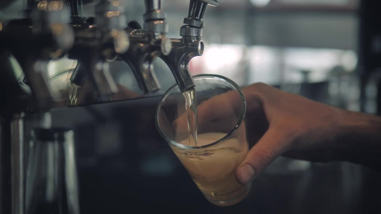 Download Stock Video Hand Of A Bartender Serving Beer Live Wallpaper For PC