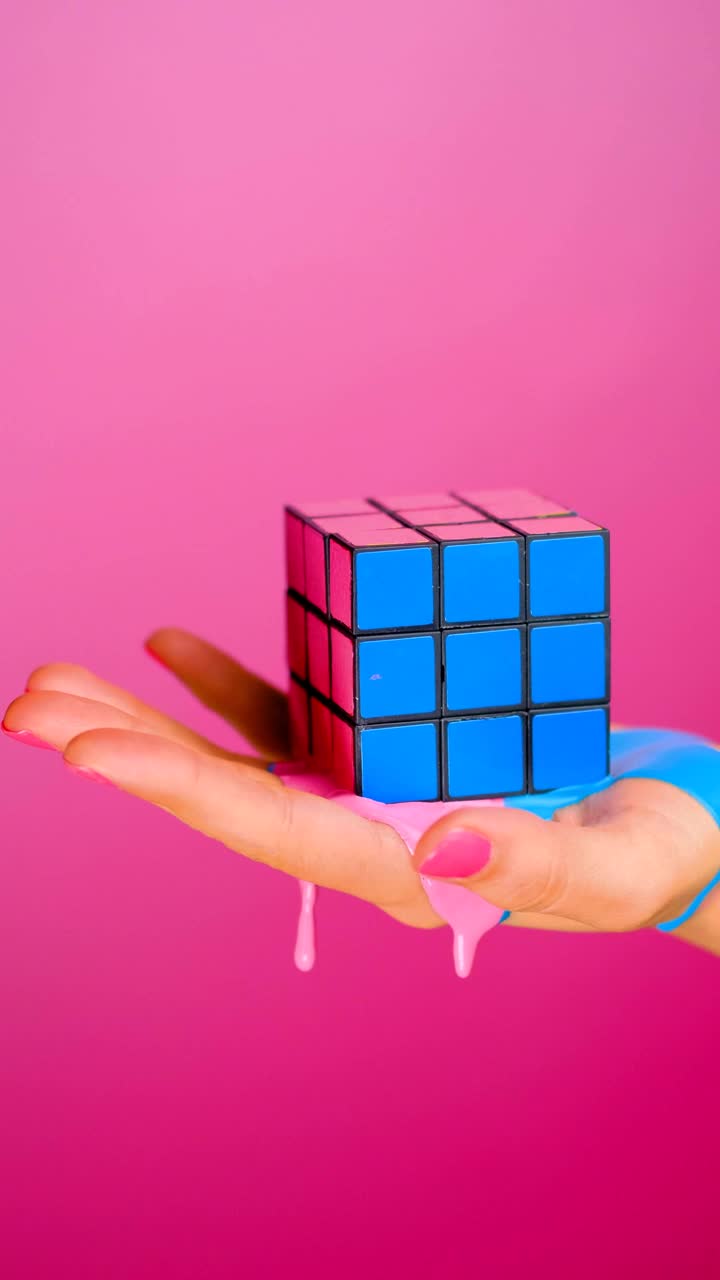 Download Stock Video Hand Holding A Rubik Cube That Seems To Melt On Live Wallpaper For PC