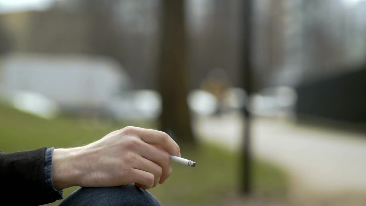 Download Stock Video Hand Holding A Cigarette Live Wallpaper For PC