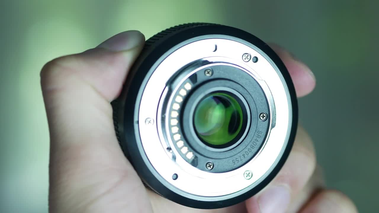 Download Stock Video Hand Holding A Camera Lens Live Wallpaper For PC