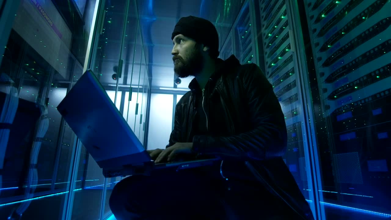 Download Stock Video Hacker Sitting On The Ground Of Data Center Live Wallpaper For PC