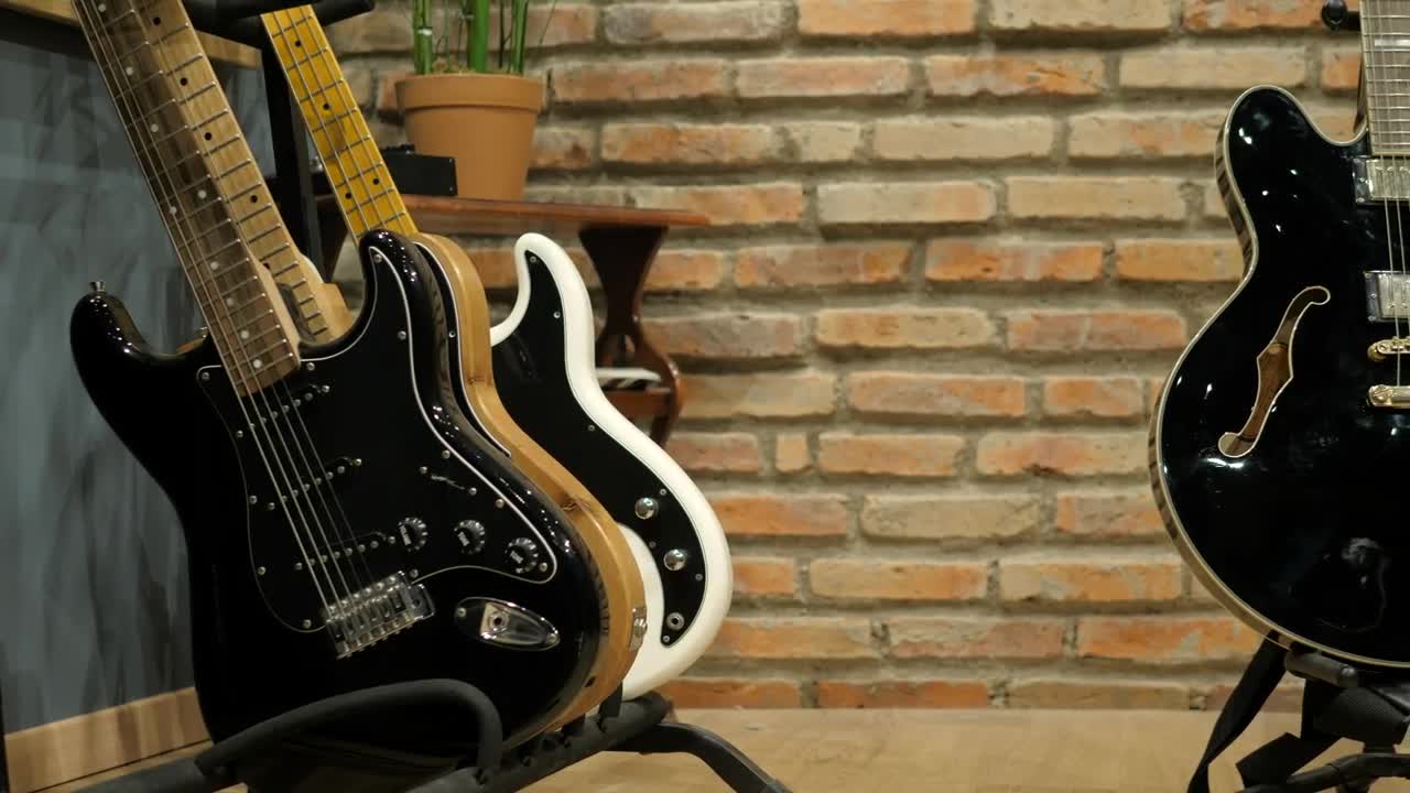 Download Stock Video Guitarist Takes An Electric Acoustic Guitar Live Wallpaper For PC