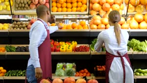 Download Stock Video Grocery Clerk Smelling Oranges Live Wallpaper For PC