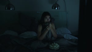 Download Stock Video Girl Watching A Horror Movie In Her Bedroom With The Live Wallpaper For PC