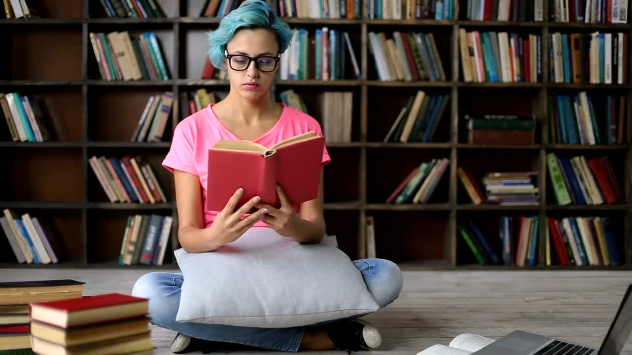 Download Stock Video Girl Studying A Book She Starts To Fall Asleep Live Wallpaper For PC