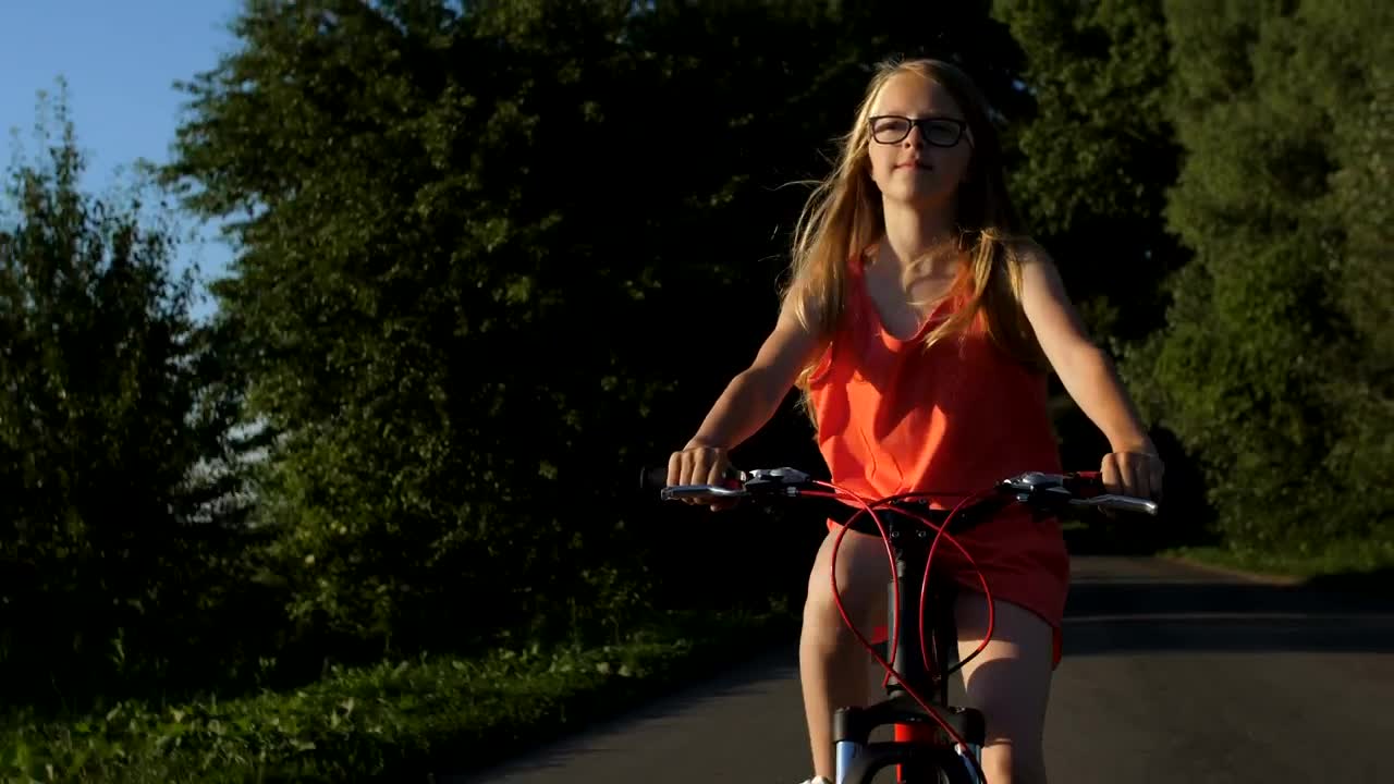 Download Stock Video Girl Riding A Bike On A Path In Nature Live Wallpaper For PC