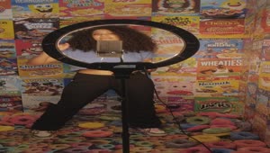 Download Stock Video Girl Recording A Video On A Background Of Cereal Boxes Live Wallpaper For PC