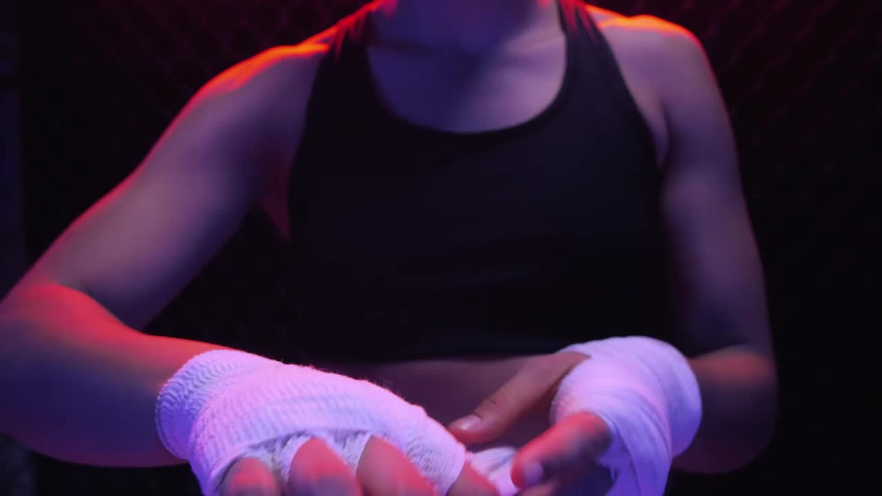 Download Stock Video Girl Putting A Bandage On Her Hands Before A Fight Live Wallpaper For PC