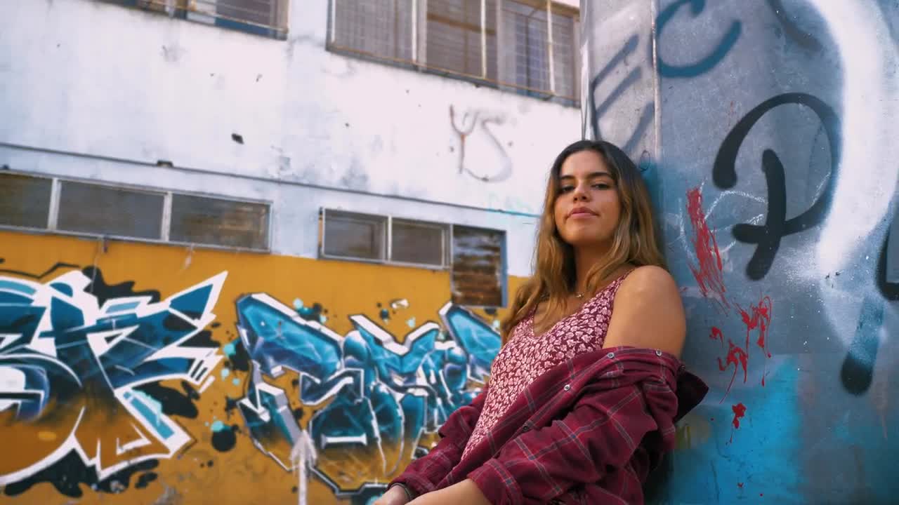 Download Stock Video Girl Leaning Against A Wall Covered In Graffiti Live Wallpaper For PC