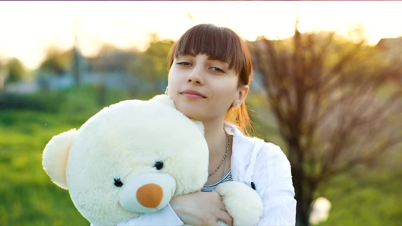 Download Stock Video Girl Hugging A Teddy Bear Outdoors Live Wallpaper For PC