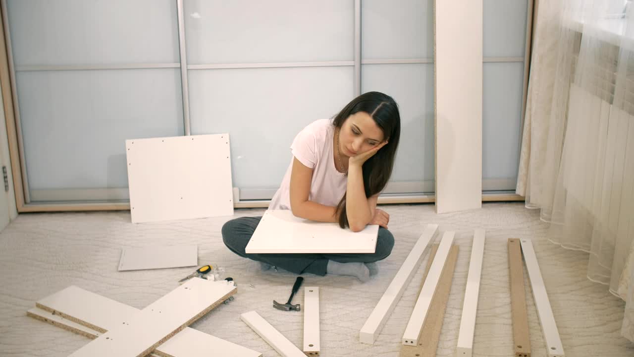 Download Stock Video Girl Frustrated When Assembling A Furniture Live Wallpaper For PC