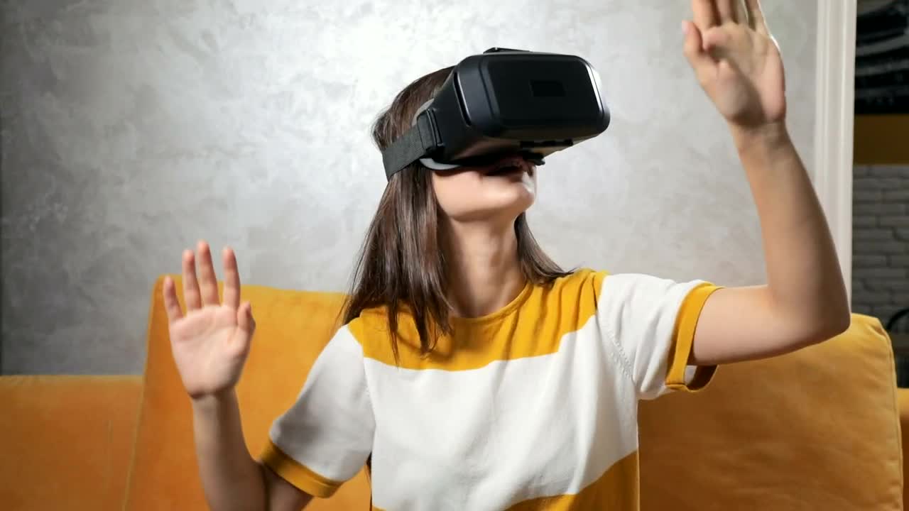 Download Stock Video Girl Experiences Vr Gaming Headset On Sofa Live Wallpaper For PC