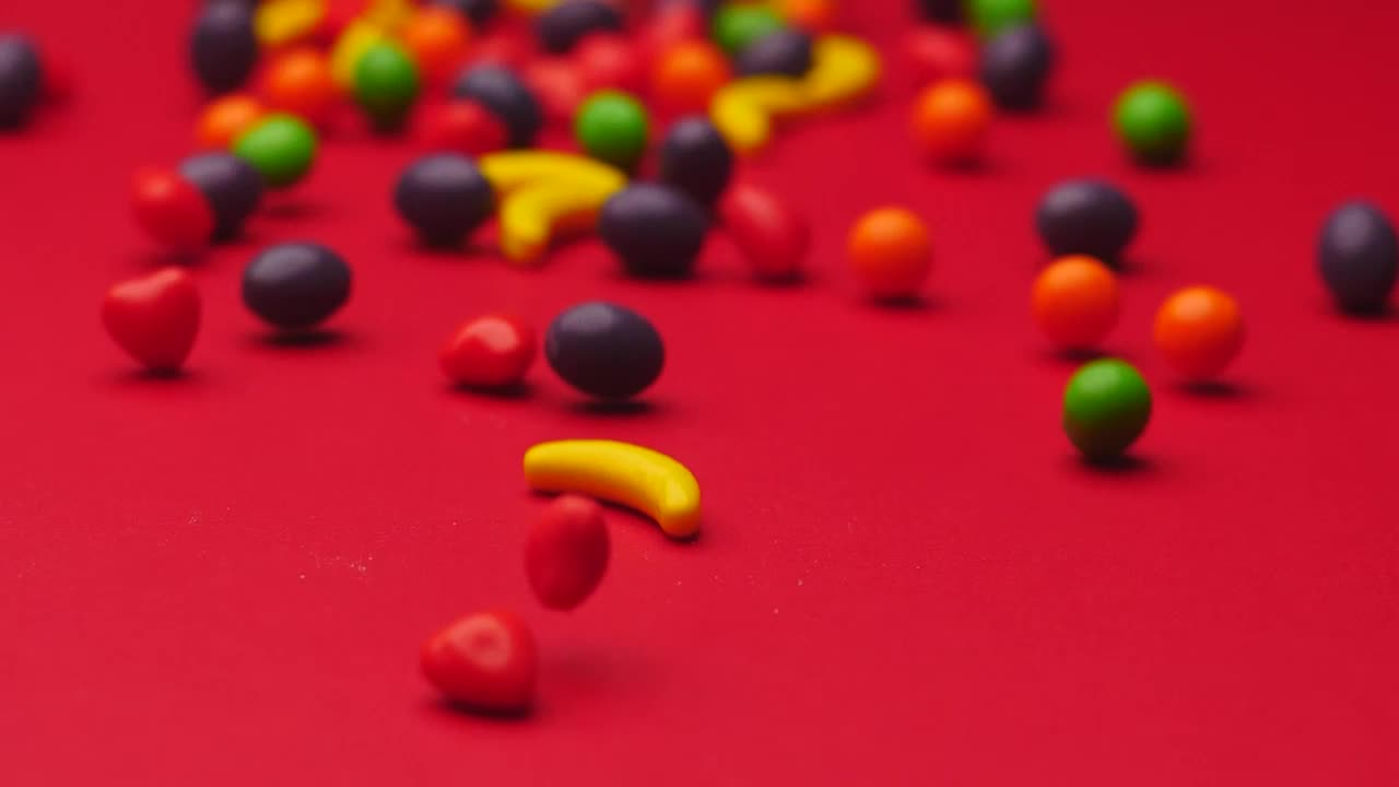 Download Stock Video Fruit Shaped Candies Sliding On A Surface Live Wallpaper For PC