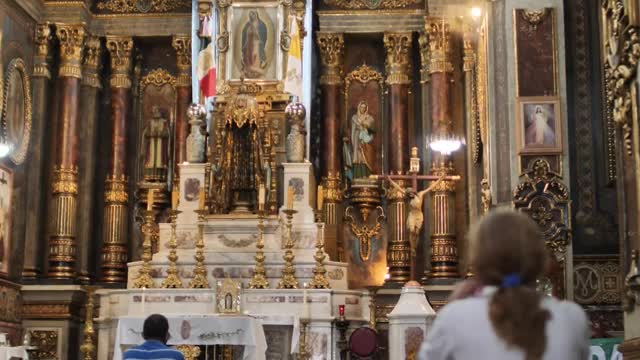 Download Stock Video Lady Praying In Front Of A Large Altar Inside A Smal Animated Wallpaper