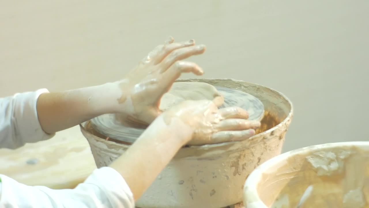 Download Stock Video Kid Working With Clay On A Pottery Wheel Animated Wallpaper