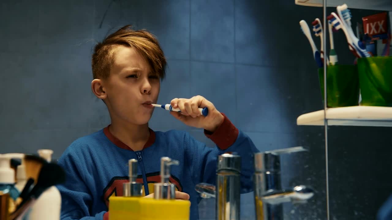 Download Stock Video Kid Brushing His Teeth In The Bathroom Animated Wallpaper