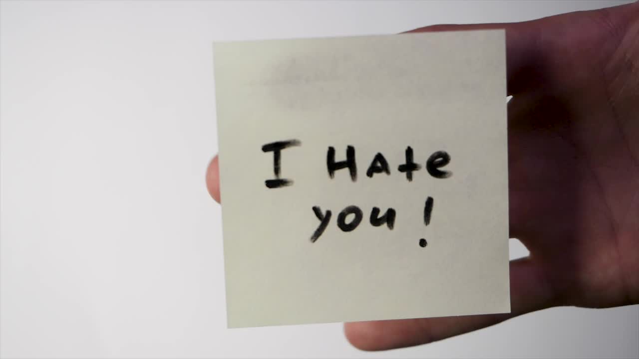 Download Stock Video Insult Written On A Note Animated Wallpaper