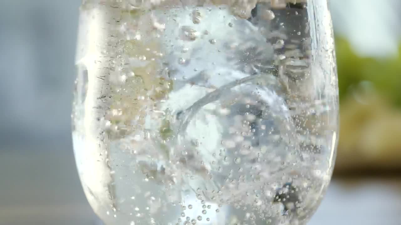 Download Stock Video Ice Cube Drops Into Mineral Water Animated Wallpaper