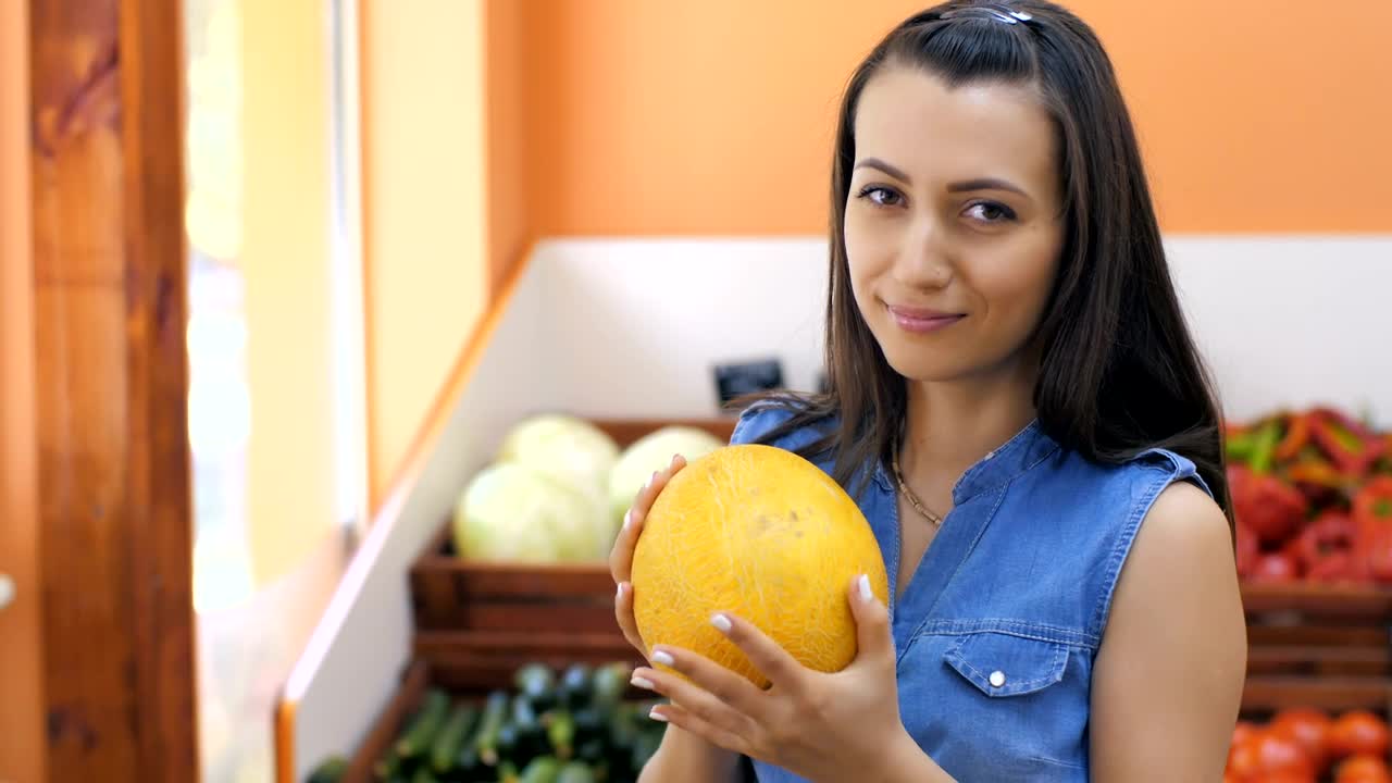 Download Stock Video Housewife Choosing Fruit At The Market Animated Wallpaper