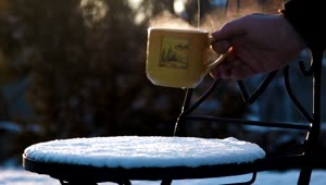 Download Stock Video Hot Tea On Our Snow Covered Chair Animated Wallpaper