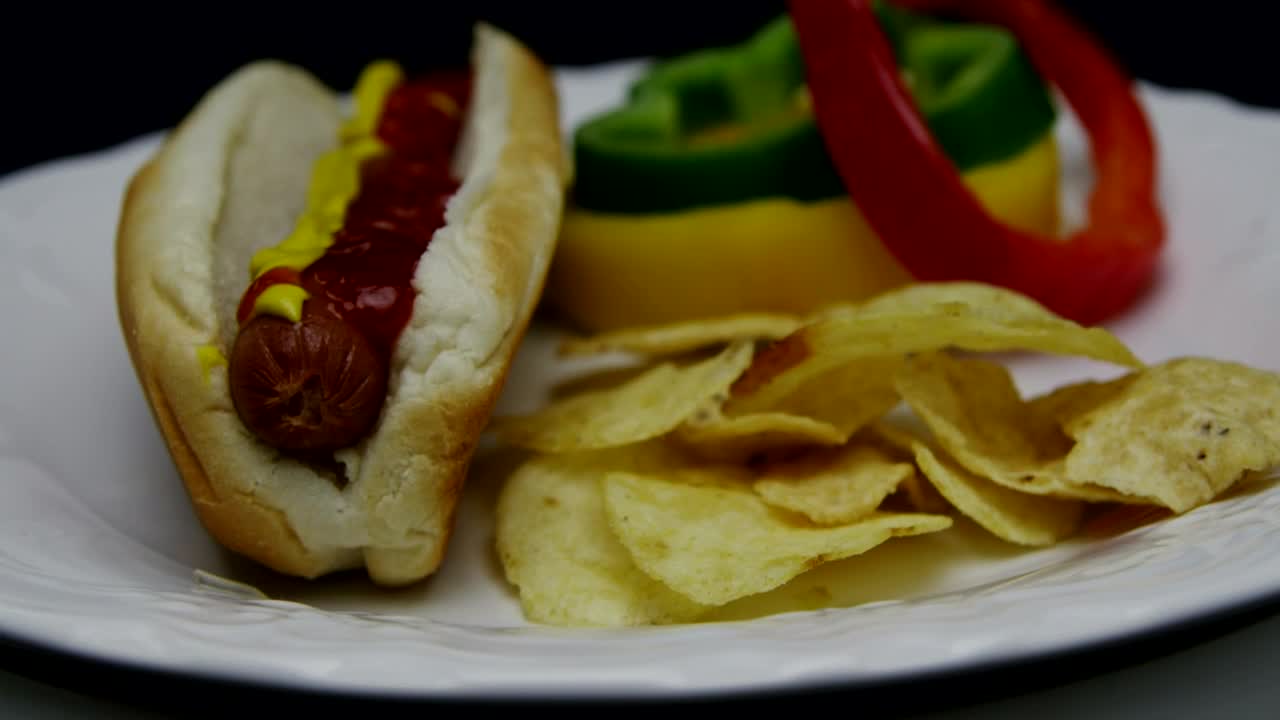 Download Stock Video Hotdog With Ketchup And Mustard Animated Wallpaper