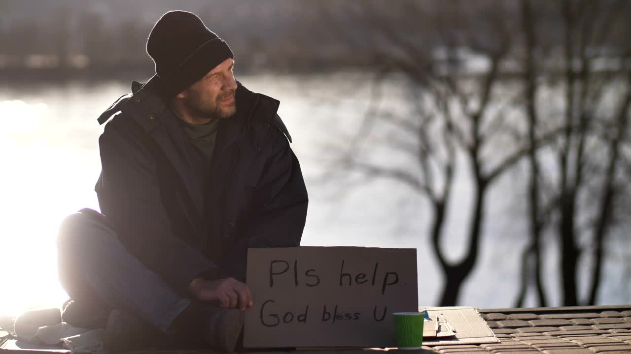 Download Stock Video Homeless Man With A Sign Animated Wallpaper