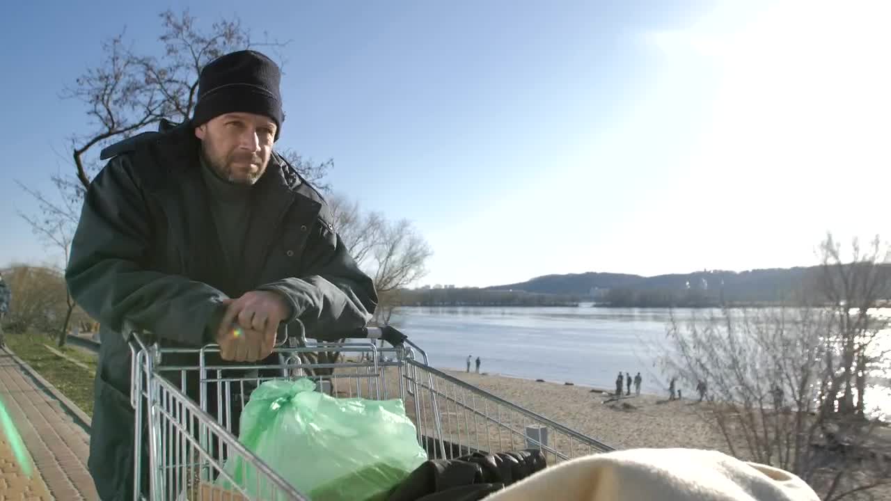 Download Stock Video Homeless Man With A Cart Of Plastic Bags Animated Wallpaper