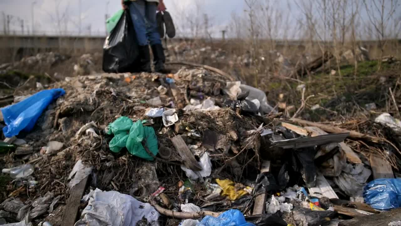 Download Stock Video Homeless Man Standing On A Pile Of Rubbish Animated Wallpaper