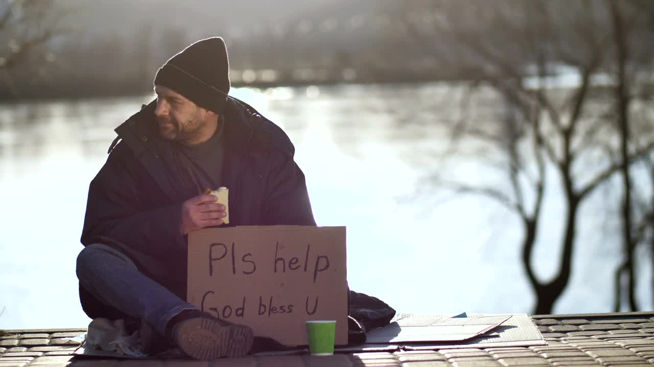 Download Stock Video Homeless Man Eating And Begging On The Street Animated Wallpaper