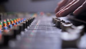 Download Stock Video Hiphop Producer Using A Mixing Console Animated Wallpaper