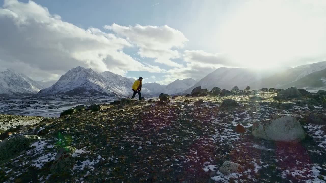 Download Stock Video Hiker Walking On A Hilly Landscape Animated Wallpaper