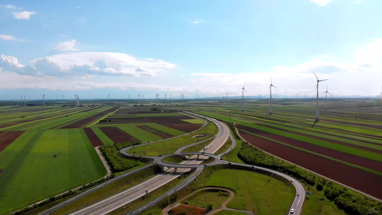 Download Stock Video Highway Traffic And A Wind Farm In The Countryside Animated Wallpaper