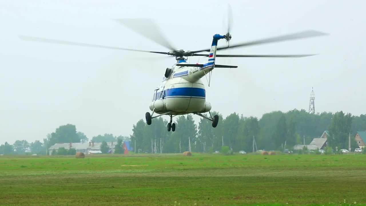 Download Stock Video Helicopter Take Off From The Field Animated Wallpaper