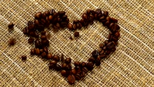 Download Stock Video Heart Of Coffee Filled With Coffee Beans On A Sack Animated Wallpaper