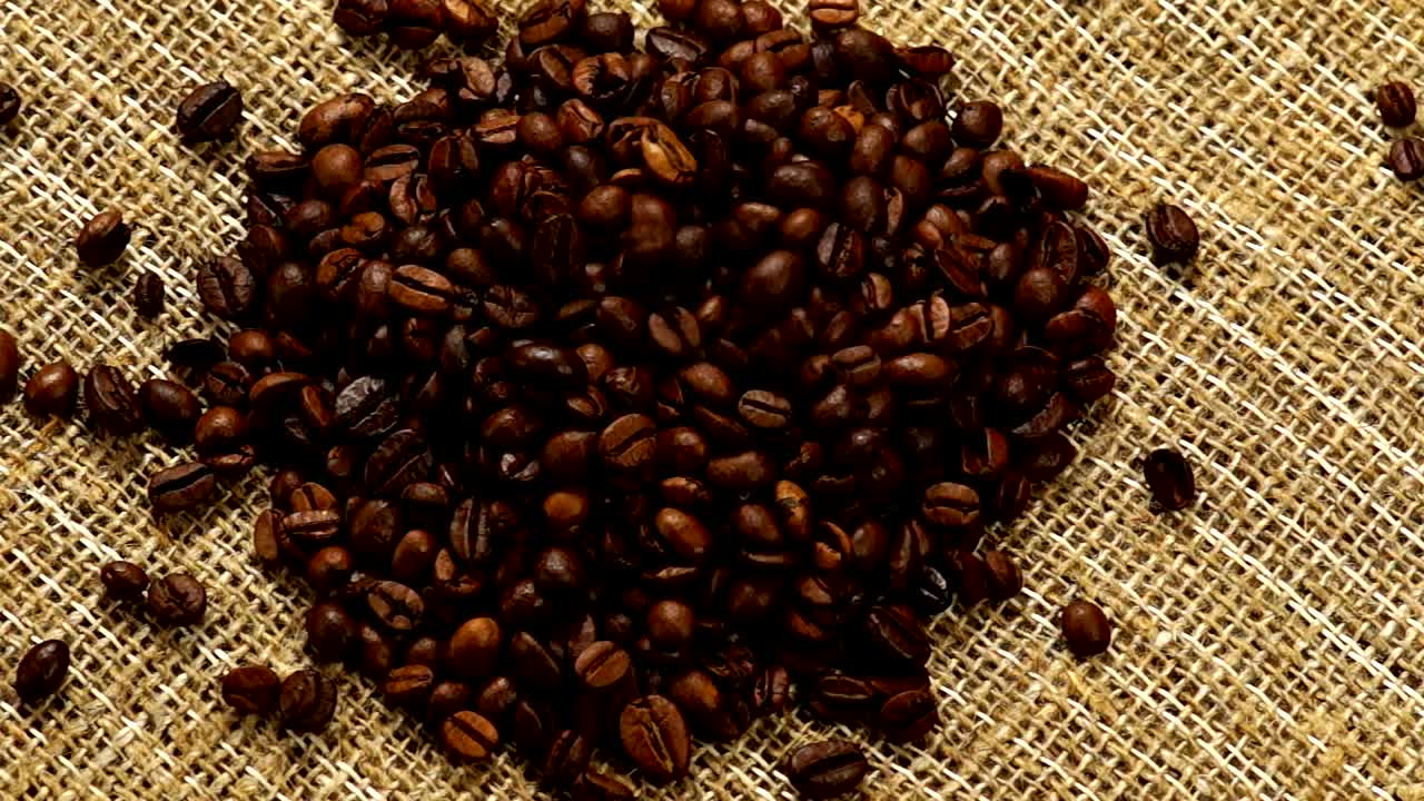 Download Stock Video Heart Of Coffee Beans On A Natural Fabric Animated Wallpaper