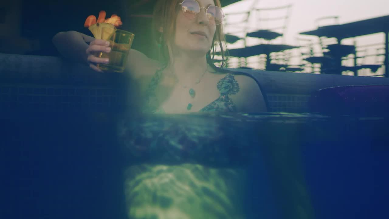 Download Stock Video Happy Young Woman Enjoying A Cocktail In The Pool Animated Wallpaper