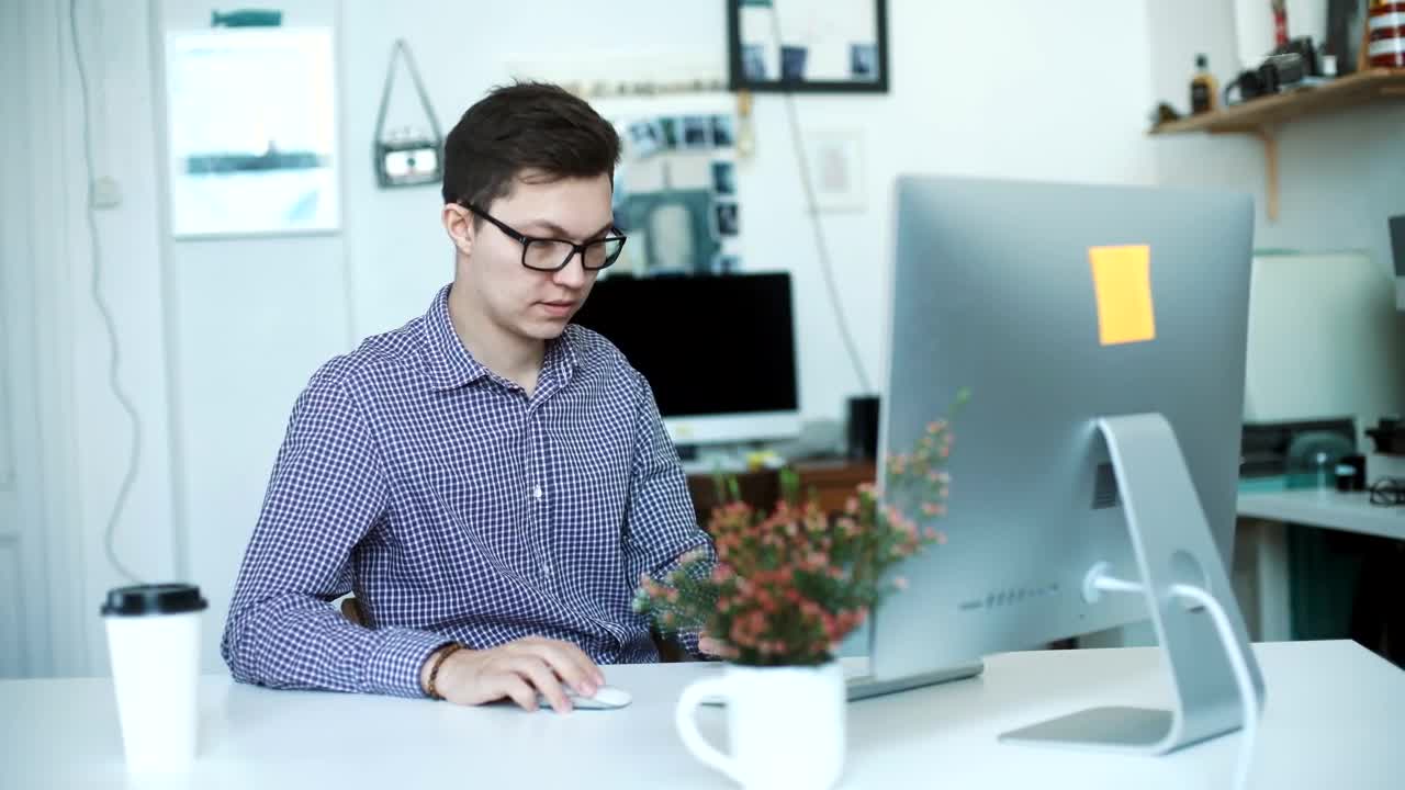 Download Stock Video Happy Young Businessman Working From Home Animated Wallpaper