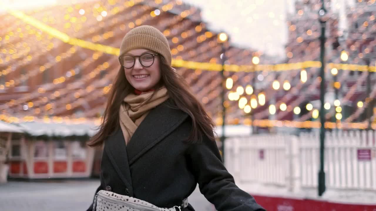 Download Stock Video Happy Woman Stands On The City Downtown At Christmas Animated Wallpaper