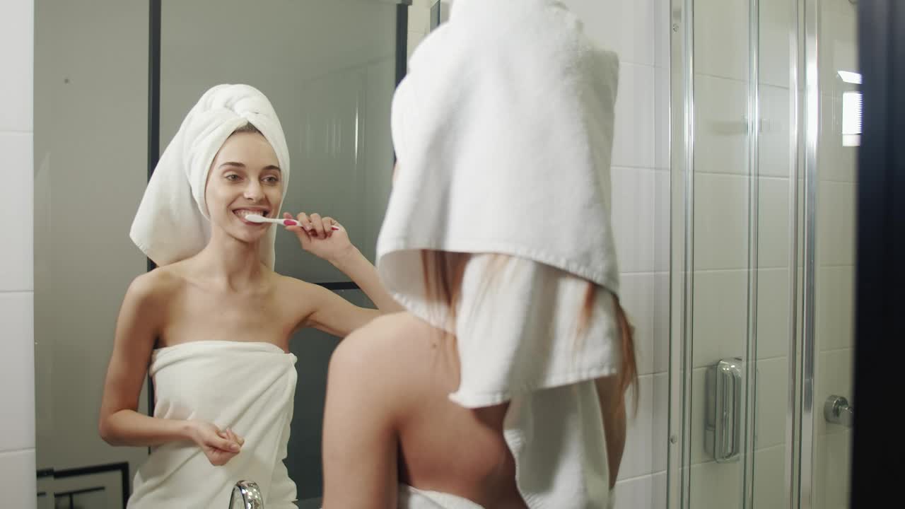 Download Stock Video Happy Woman Brushing Her Teeth In Her Morning Routine Animated Wallpaper