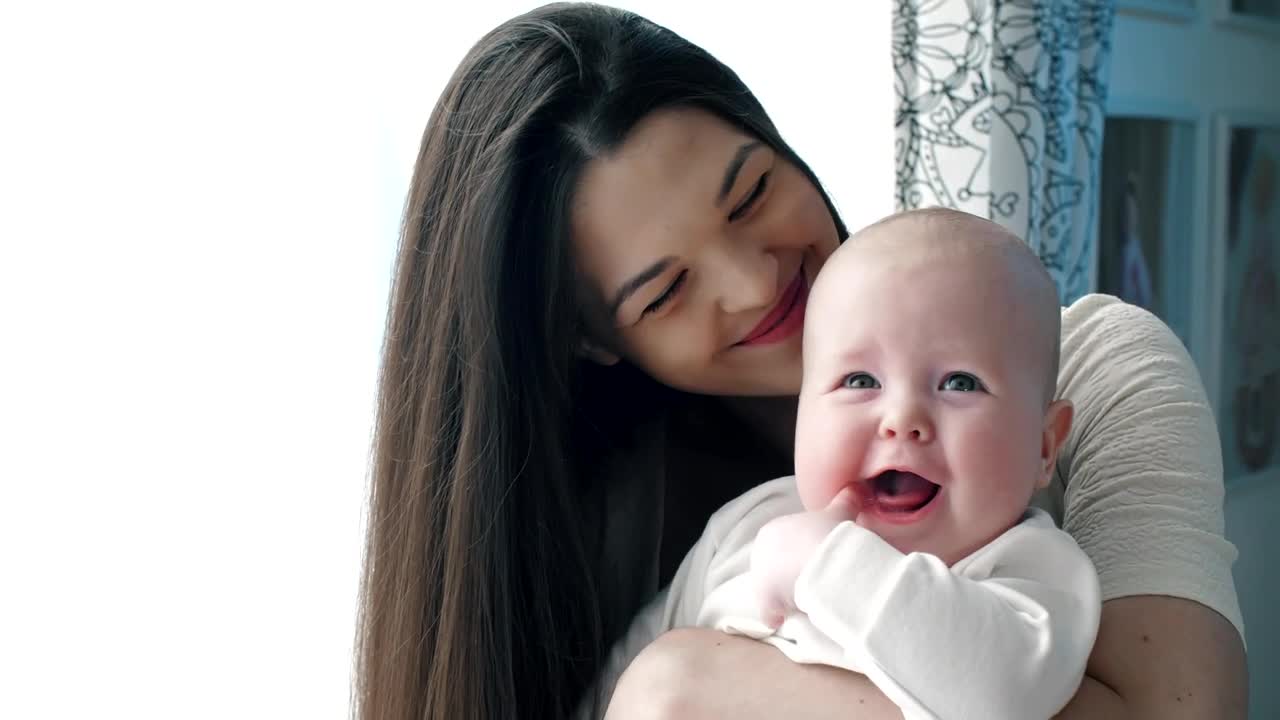 Download Stock Video Happy Mother Hugging Her Baby Animated Wallpaper