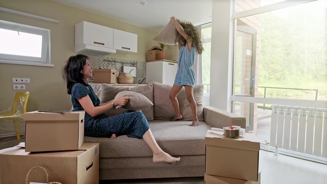 Download Stock Video Happy Mom And Daughter Playing With Pillows Animated Wallpaper