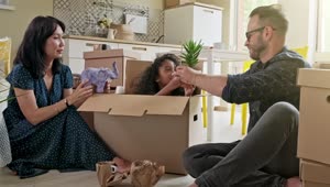 Download Stock Video Happy Mixed Ethnicity Family Unpacking Boxes Animated Wallpaper