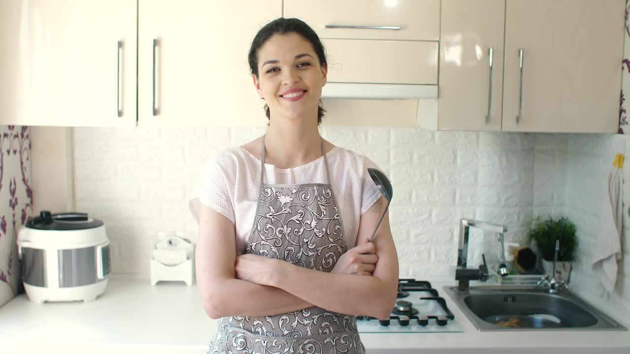 Download Stock Video Happy Housewife In The Kitchen Animated Wallpaper