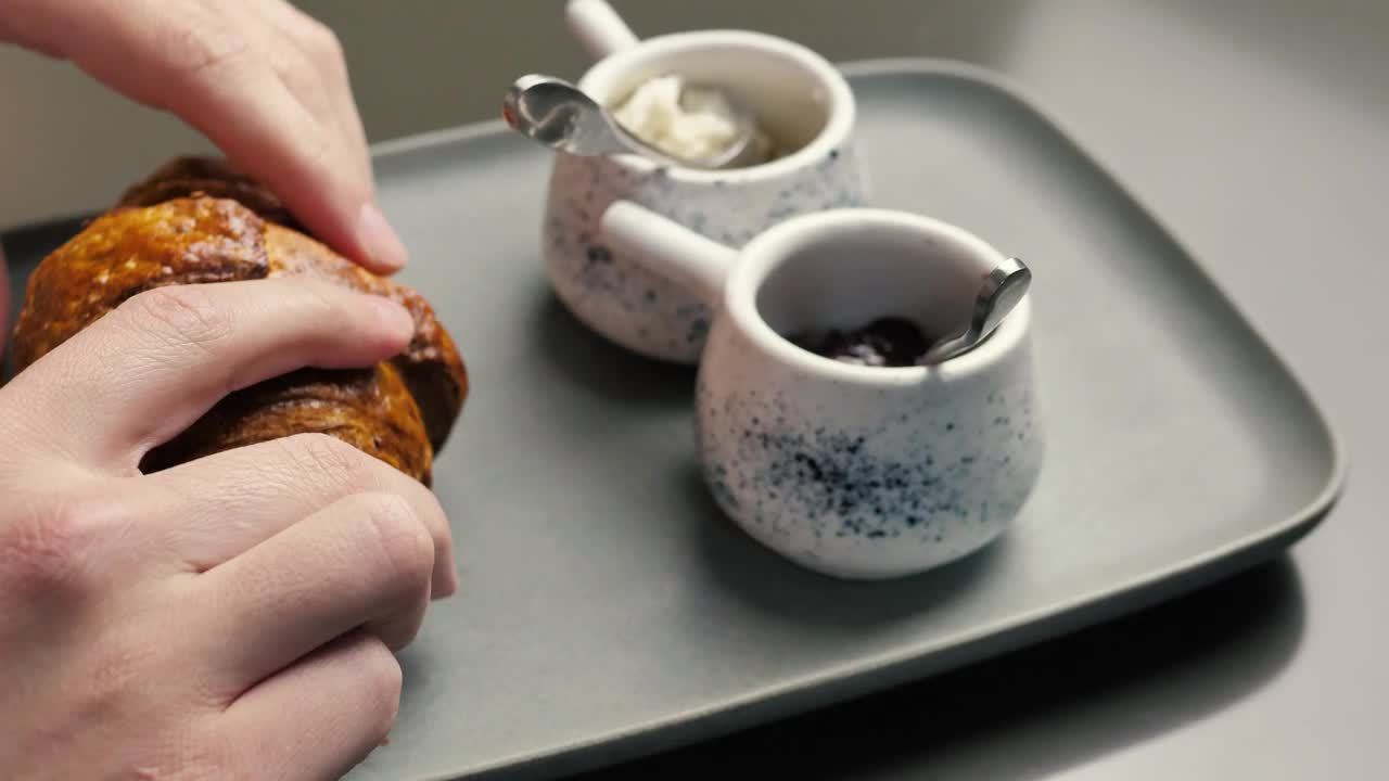 Download Stock Video Hands Splitting A Croissant In Half Animated Wallpaper