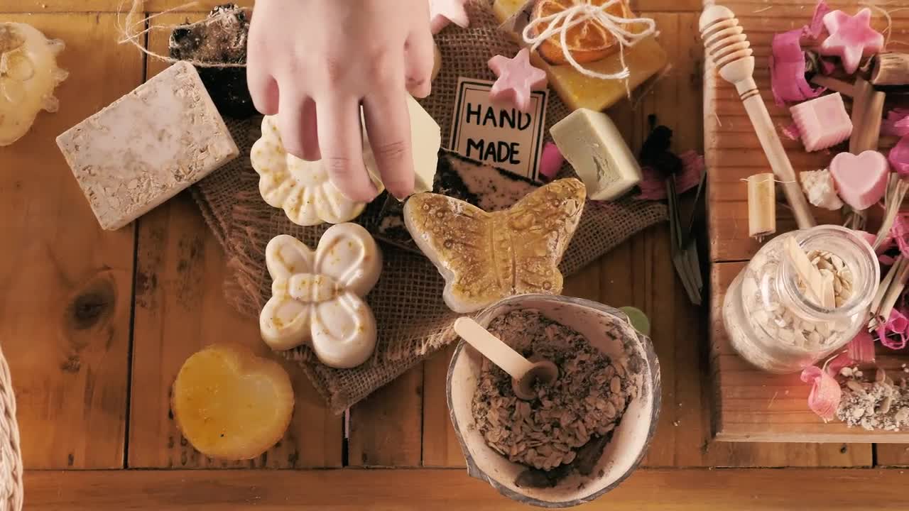 Download Stock Video Hands Selecting And Packaging Handmade Soaps Animated Wallpaper